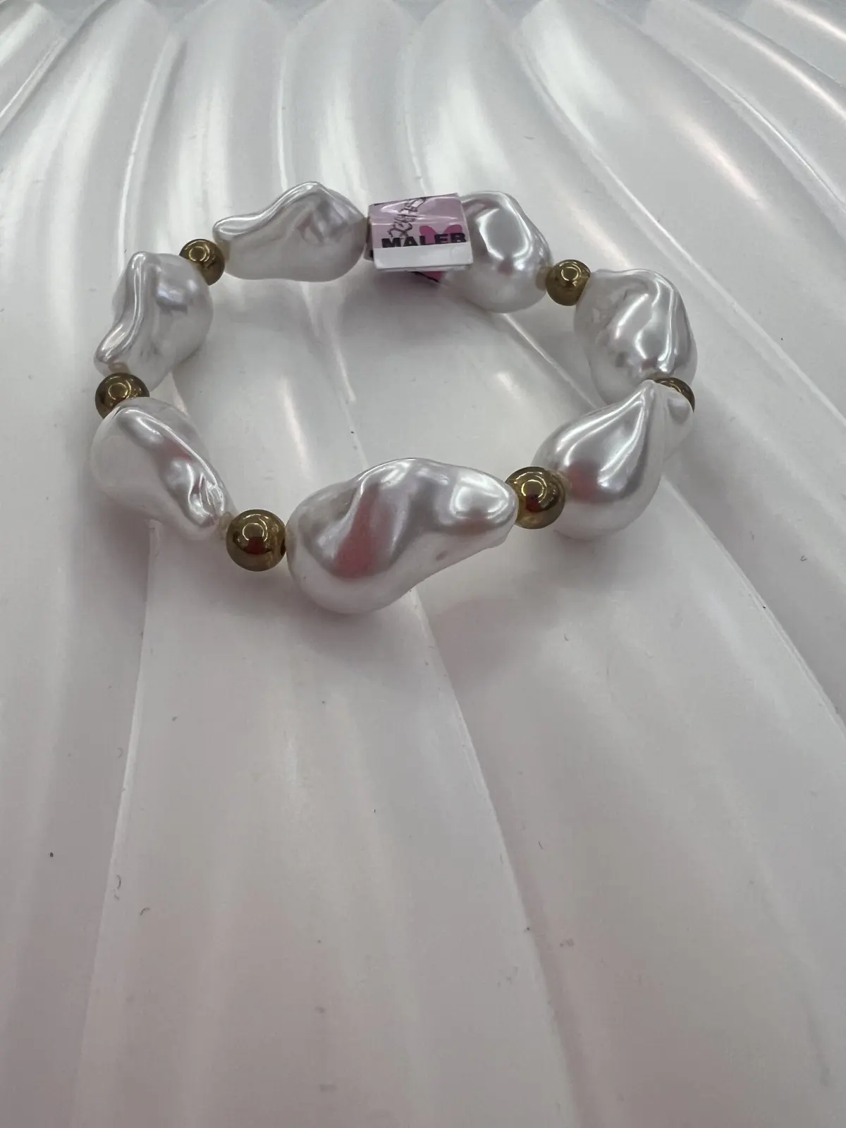 PULSERA BLANCA CON DORADO