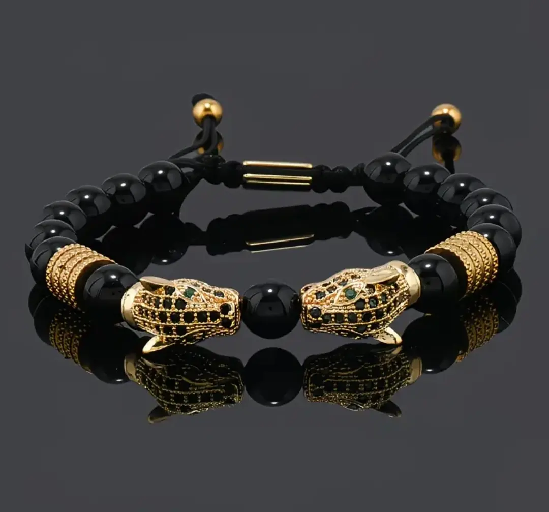Pulsera negra con doradas panteras