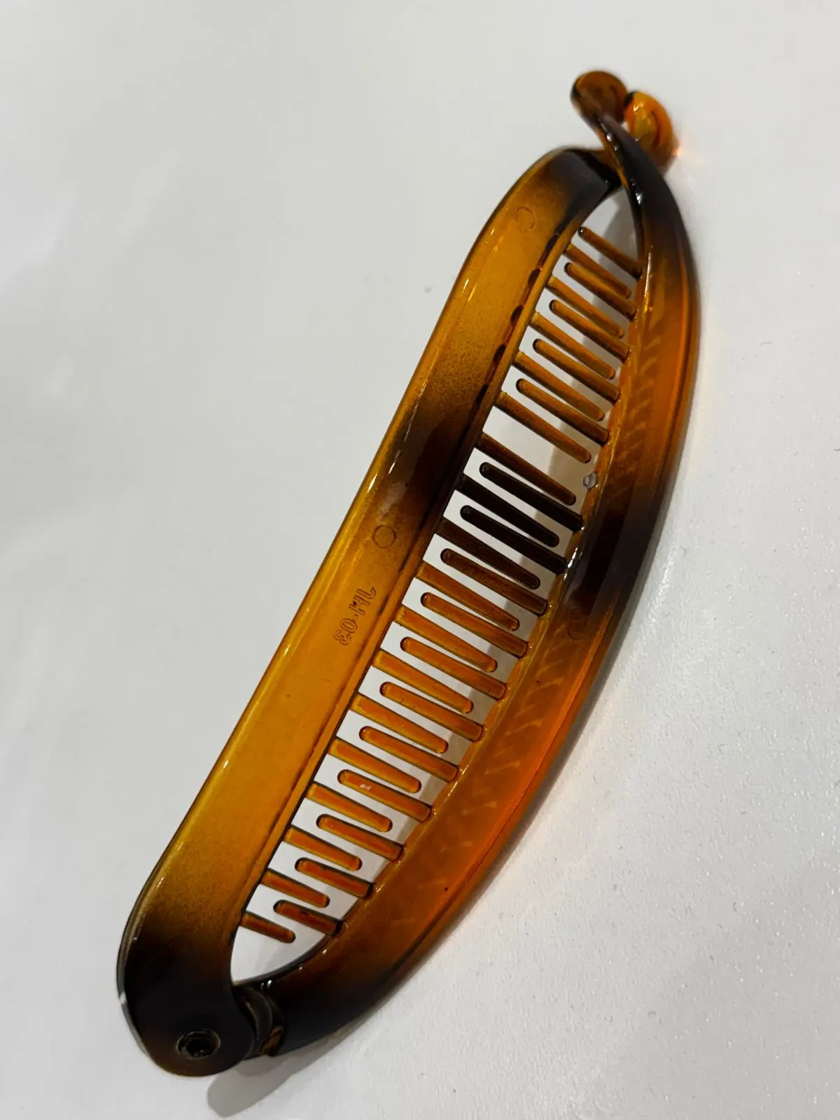 Banana clip naranja con negro