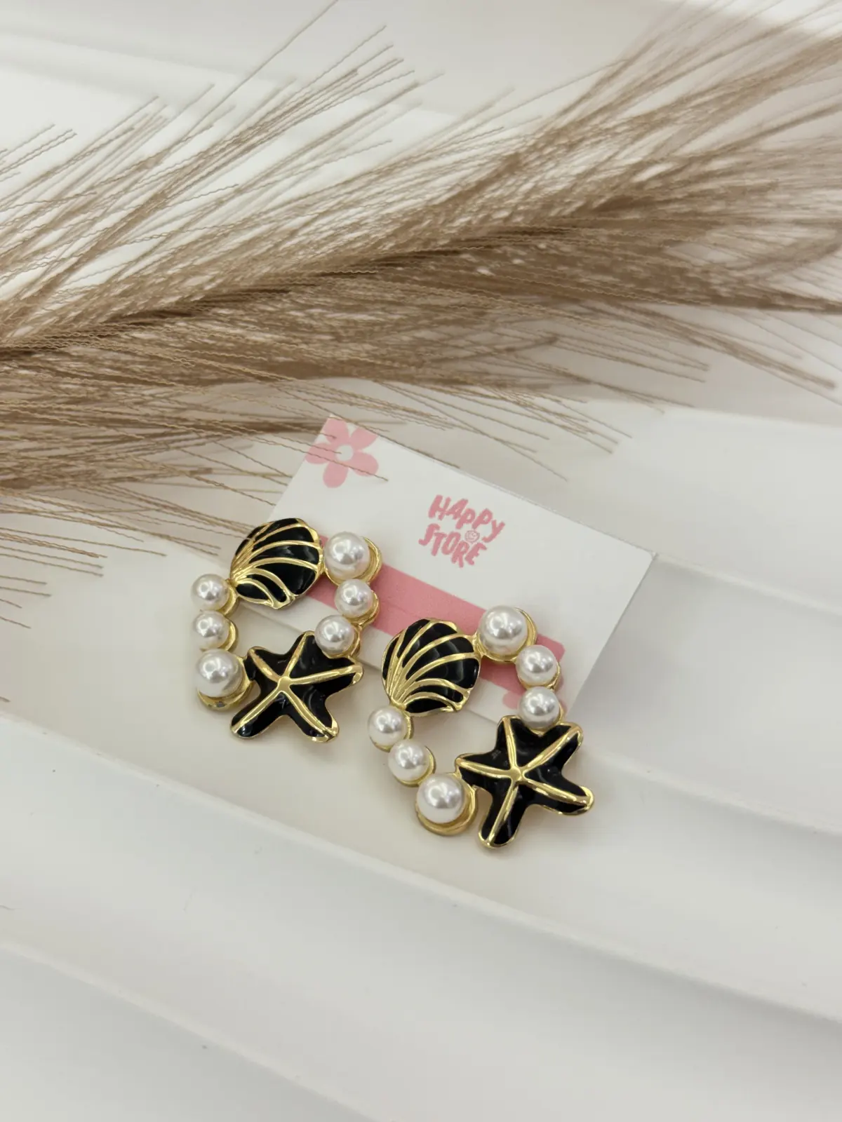 P01-857 Aretes dorados concha y estrella negra con perlass